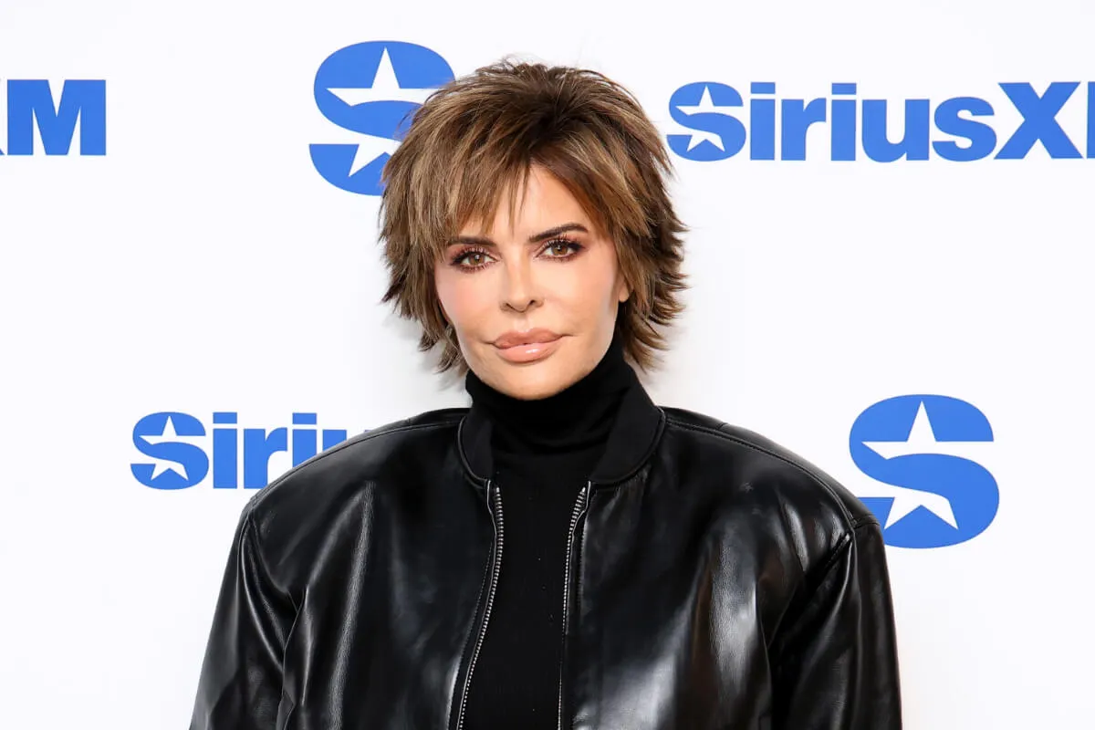 'RHOBH' star Lisa Rinna wears a black turtleneck and black leather jacket.