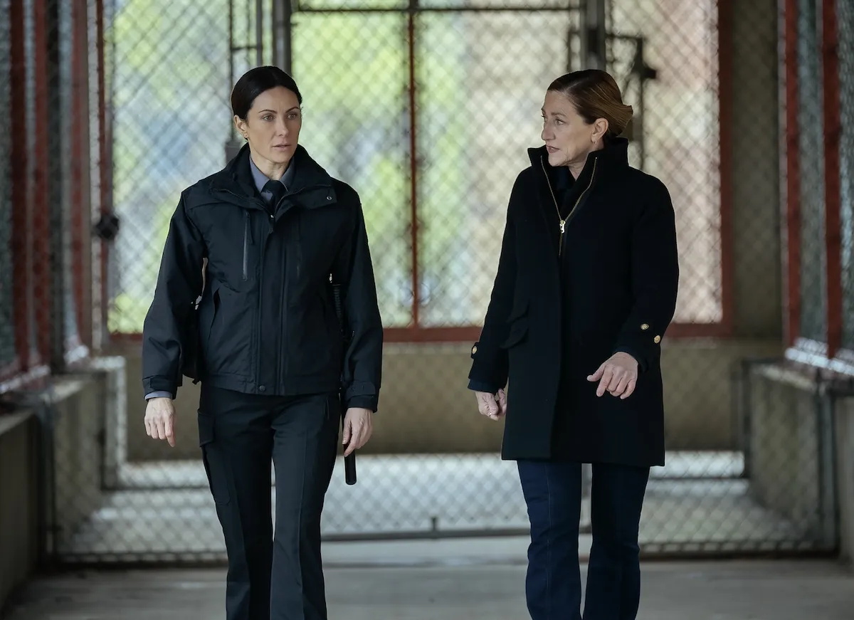 Laura Benanti and Edie Falco walking next to each other in 'Mayor of Kingstown'