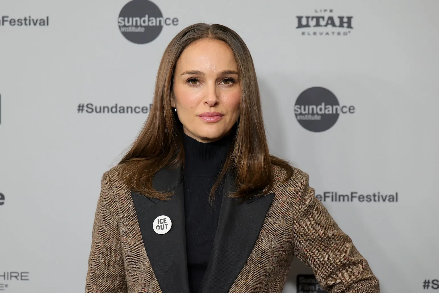 Natalie Portman wearing an Ice Out pin at Sundance Film Festival in 2026