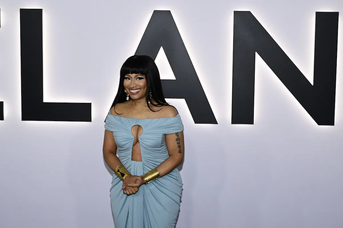 Nicki Minaj, in a blue Grecian-style dress, ast the premiere of 'Melania'