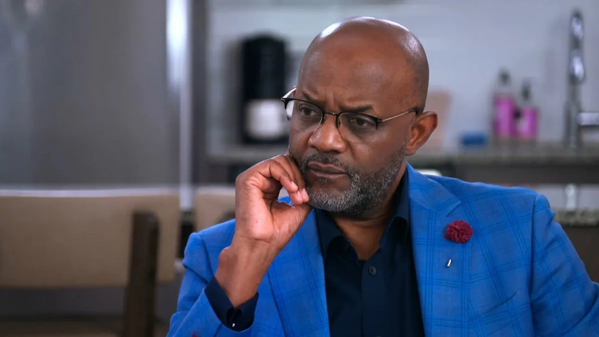 Pastor Cal Roberson, wearing a blue jacket and looking concerned, in 'Married at First Sight'
