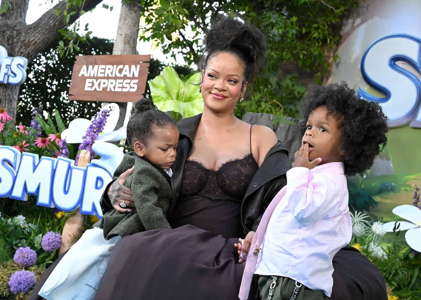 Rihanna holding her sons, Riot Rose Mayers and RZA Athelston Mayers, at the 'Smurfs' premiere
