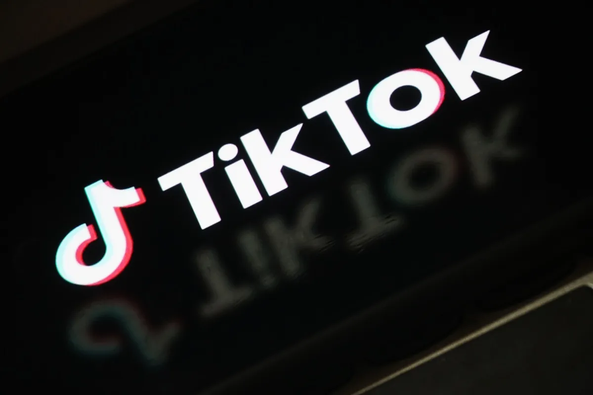 The TikTok logo is displayed on a smartphone screen on December 19, 2025 i