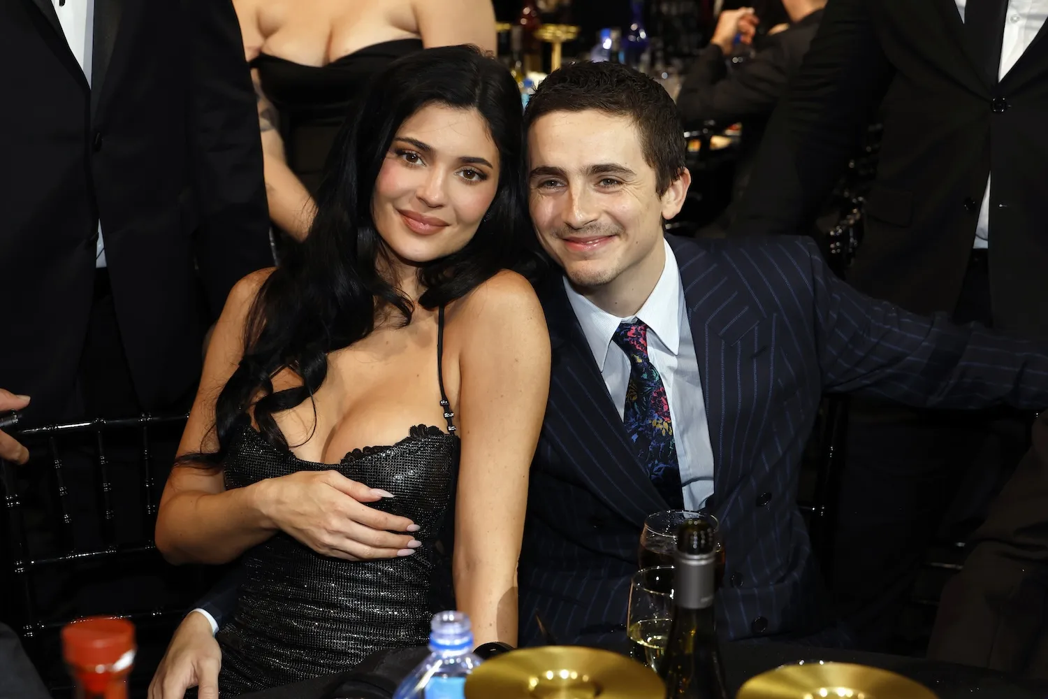 Kylie Jenner and Timothée Chalamet sitting together and smiling at the Critics' Choice Awards in 2026