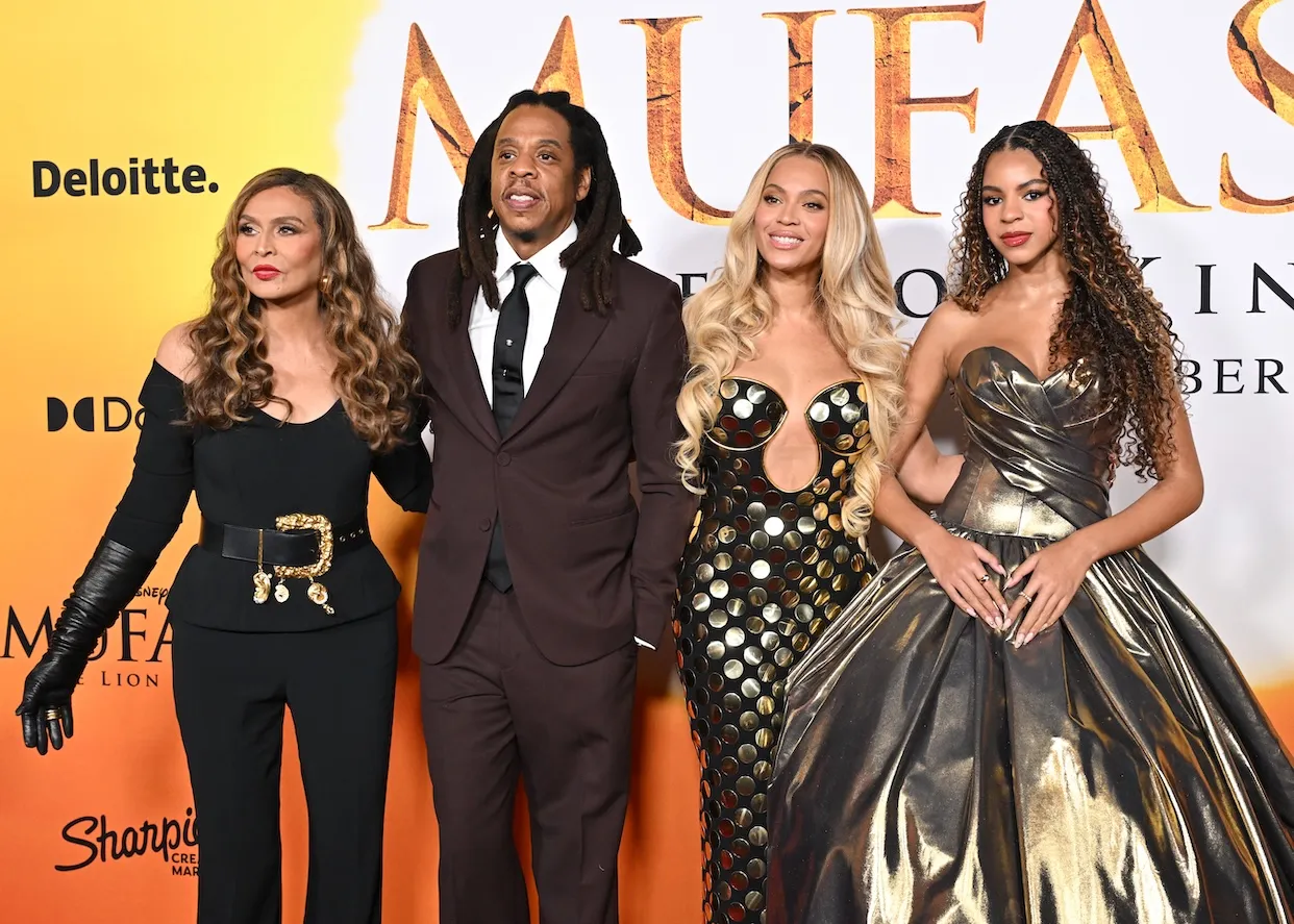 Tina Knowles, Jay-Z, Beyoncé, and Blue Ivy Carter standing together for a movie premiere
