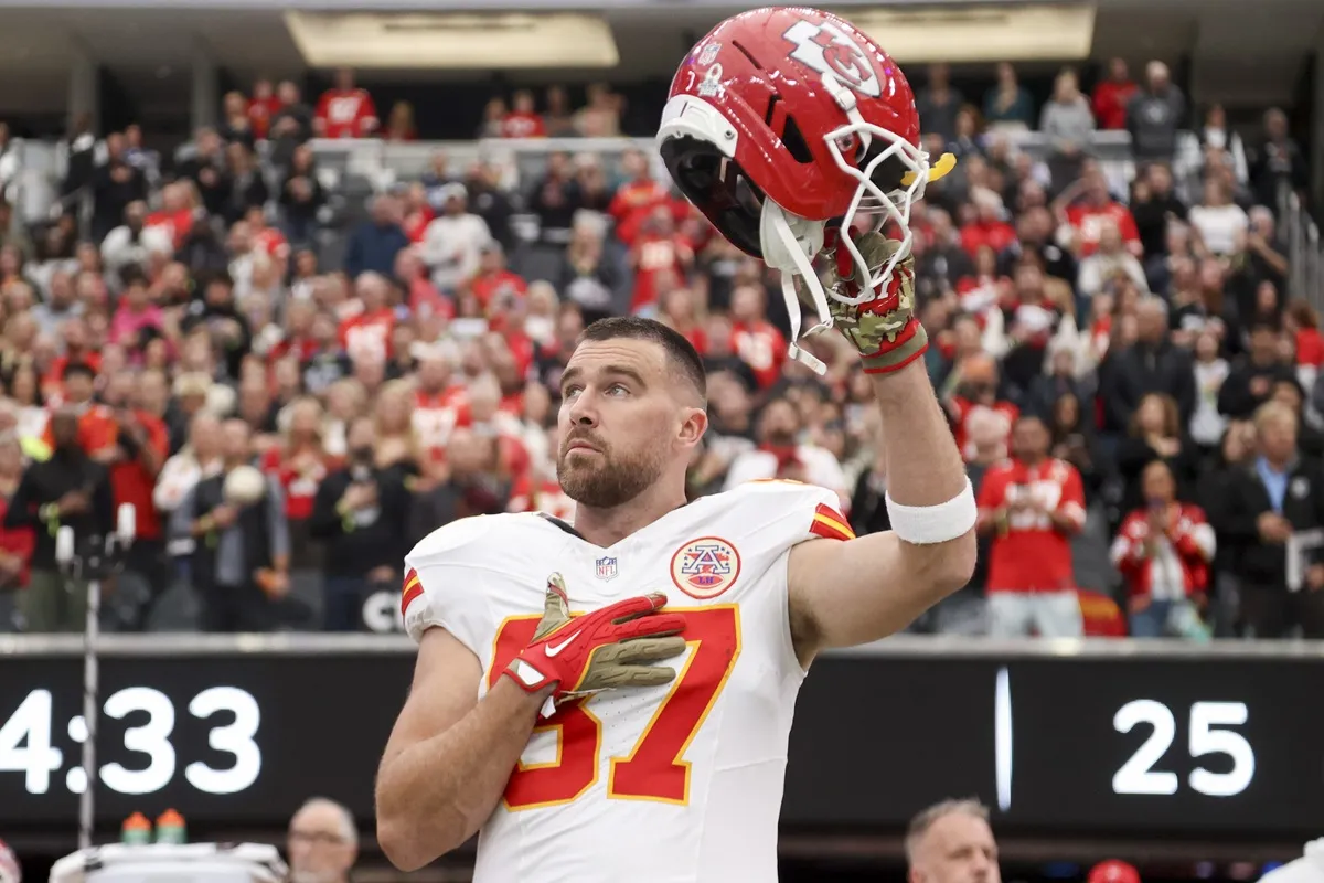 Travis Kelce #87 of the Kansas City Chiefs gestures during the National Anthem prior to the game against the Las Vegas Raiders