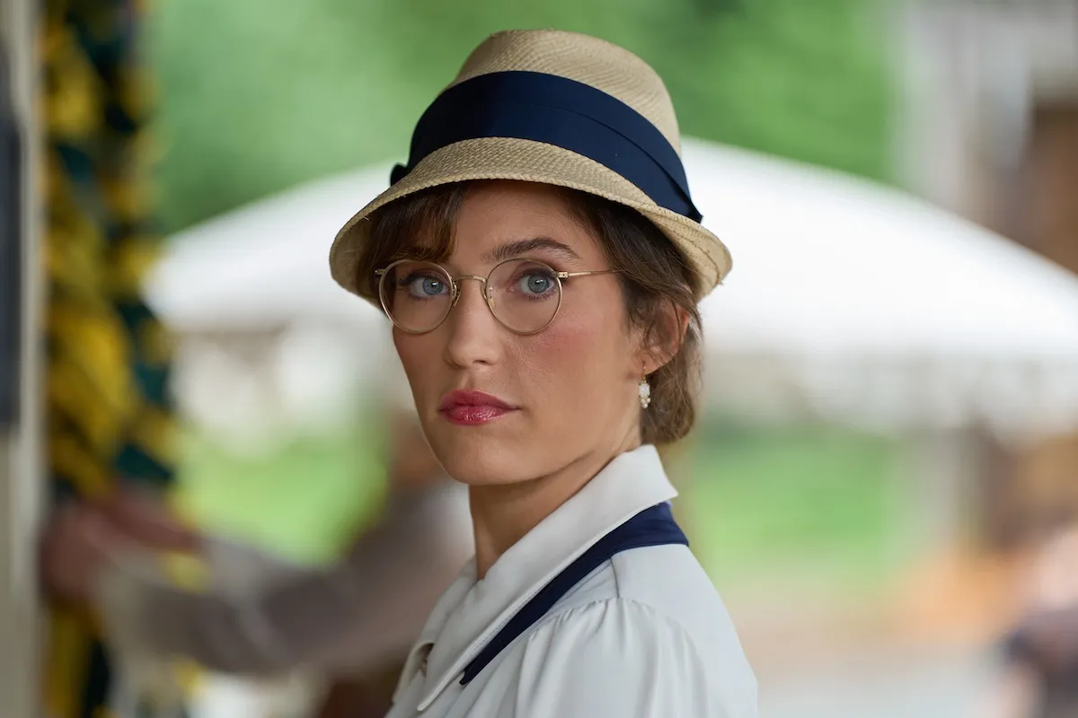 Miranda MacDougall as Edie Martell, wearing a hat and glasses, in 'When Calls the Heart' Season 13