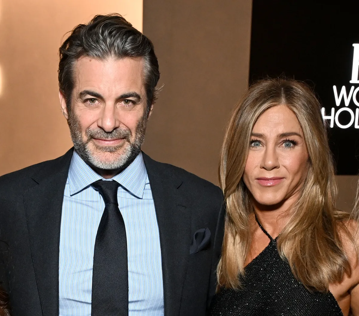 Jim Curtis and Jennifer Aniston, wearing Ralph Lauren, attend ELLE's 2025 Women in Hollywood Celebration