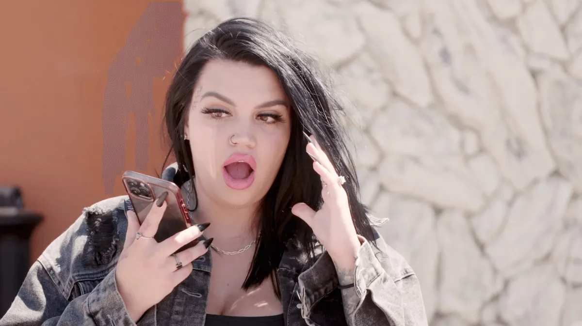 Emily talking into a cellphone in 'Love During Lockup'