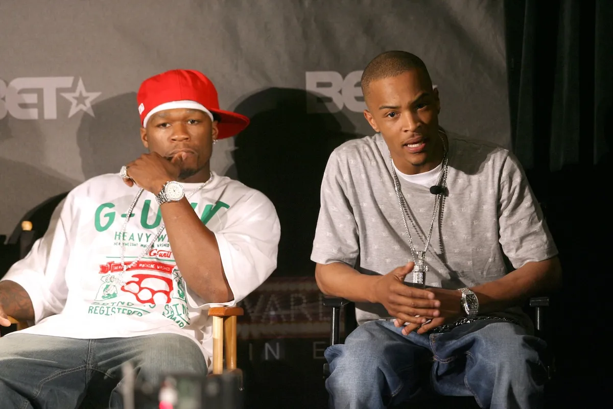 50 Cent and T.I. sitting in chairs next to each other at the BET Awards in 2007