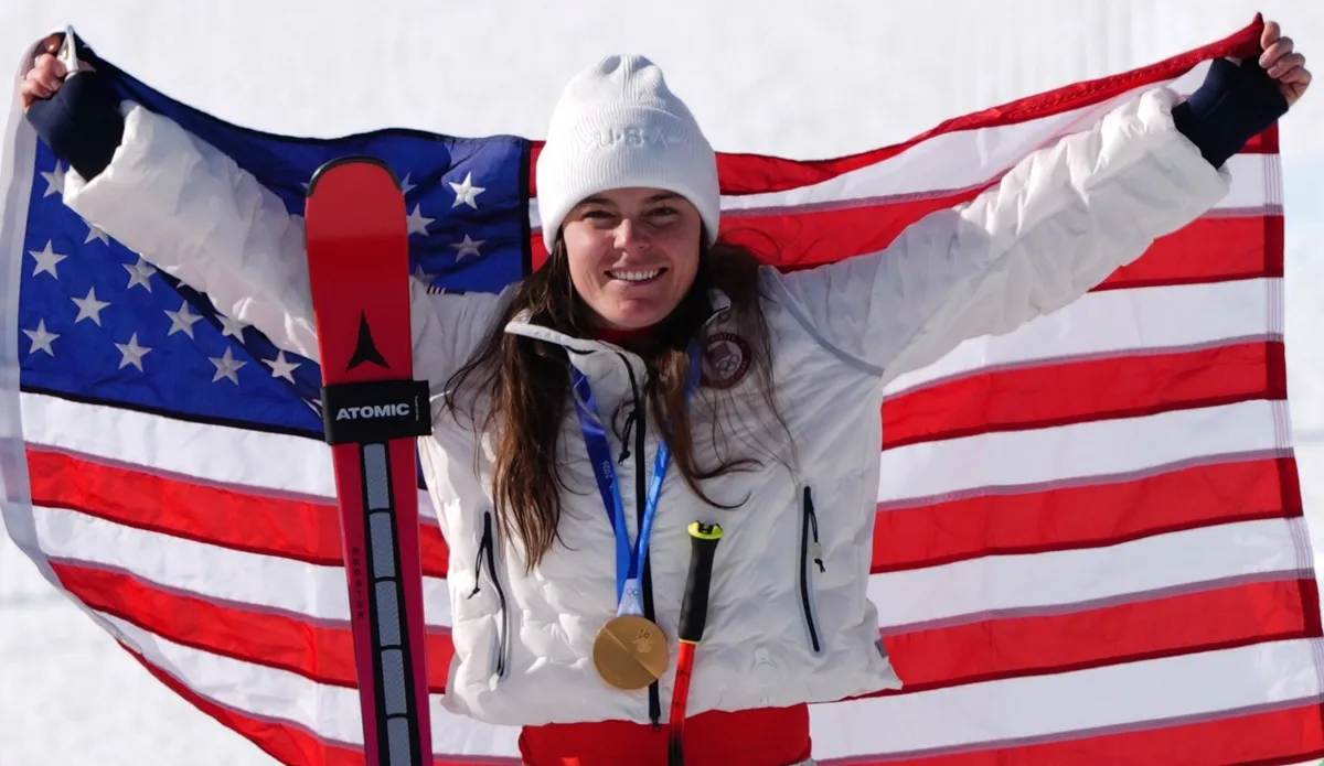 Breezy Johnson on the podium after winning gold in the Women's Alpine Downhill Skiing