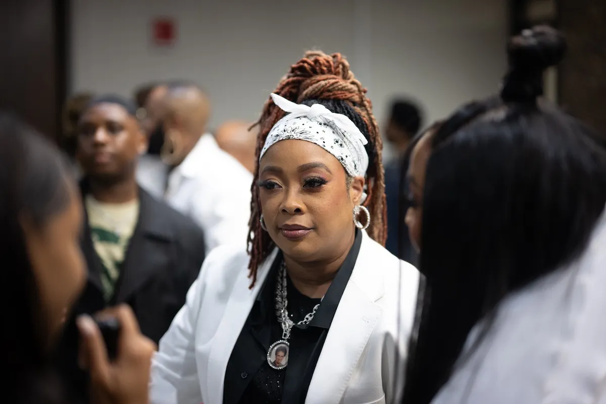 Da Brat with braids and a white headscarf