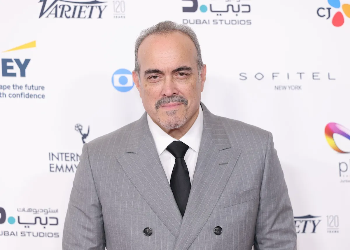 David Zayas wearing a gray double-breasted suit