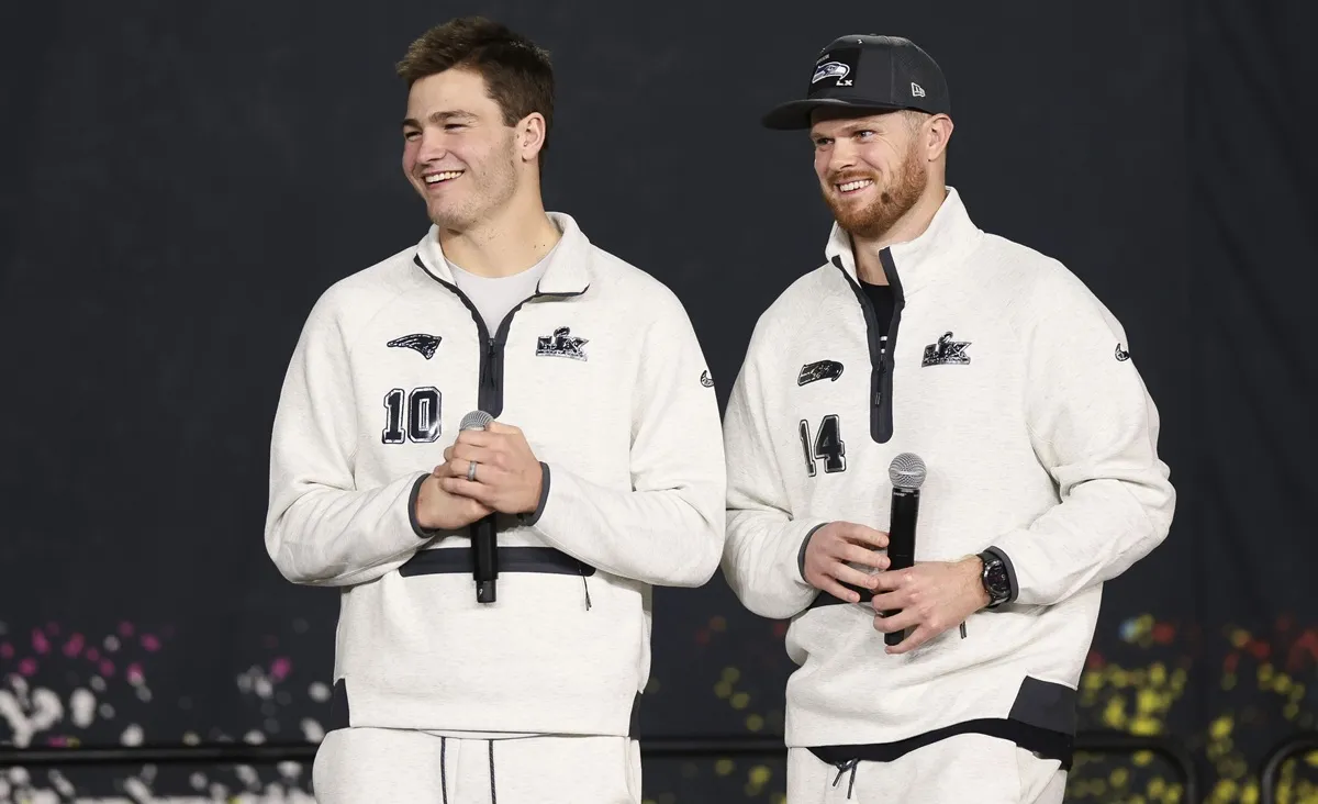 Drake Maye of the New England Patriots and Sam Darnold of the Seattle Seahawks laugh Super Bowl LX Opening Night