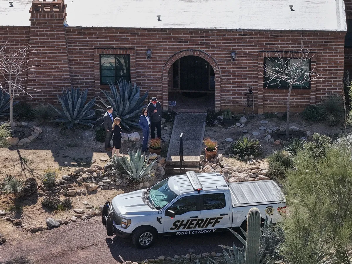 In an aerial view, law enforcement officials visit Nancy Guthrie's residence on February 25, 2026 in Tucson, Arizona. Law enforcement officials continue to search for Nancy Guthrie, the 84-year-old mother of U.S. journalist and television host Savannah Guthrie,