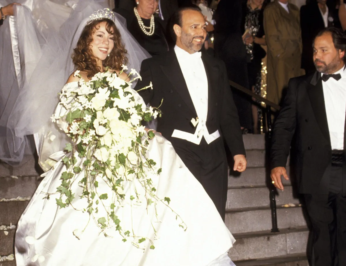Mariah Carey and Tommy Mottola leave their wedding in 1993
