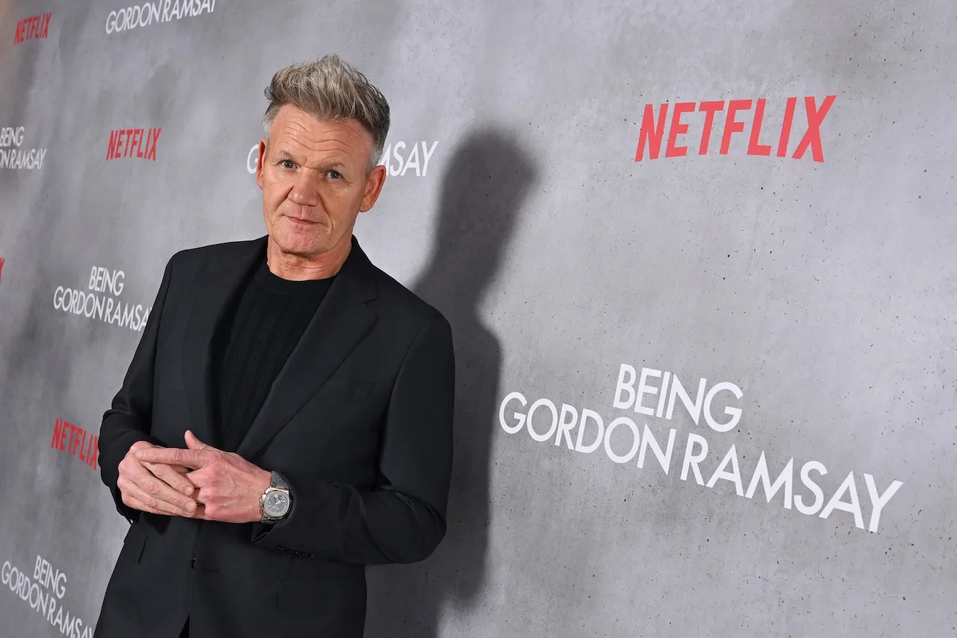 Gordon Ramsay posing in front of a backdrop for Netflix's 'Being Gordon Ramsay'