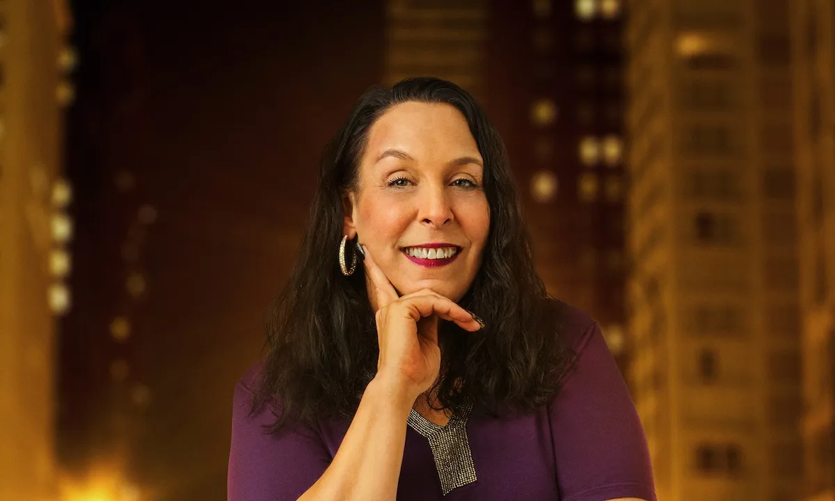 Portrait of Kim Menzies from '90 Day: The Single Life' with her hand on her cheek