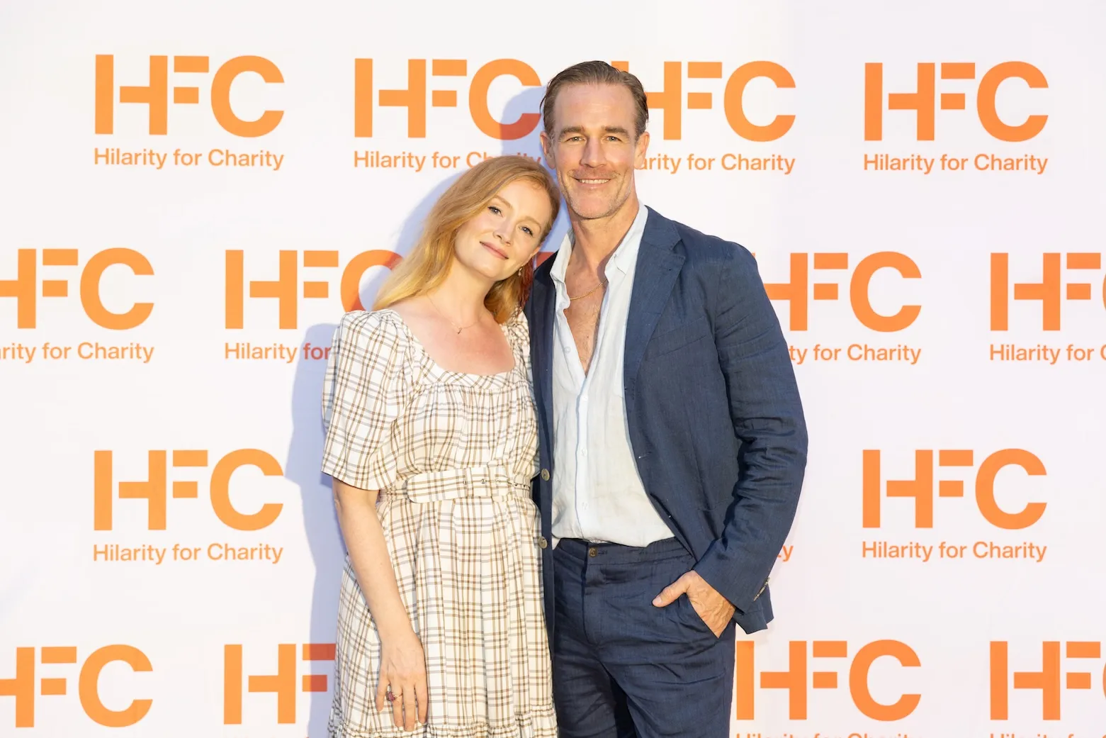 James Van Der Beek (R) and wife Kimberly Van Der Beek posing at an HFC event