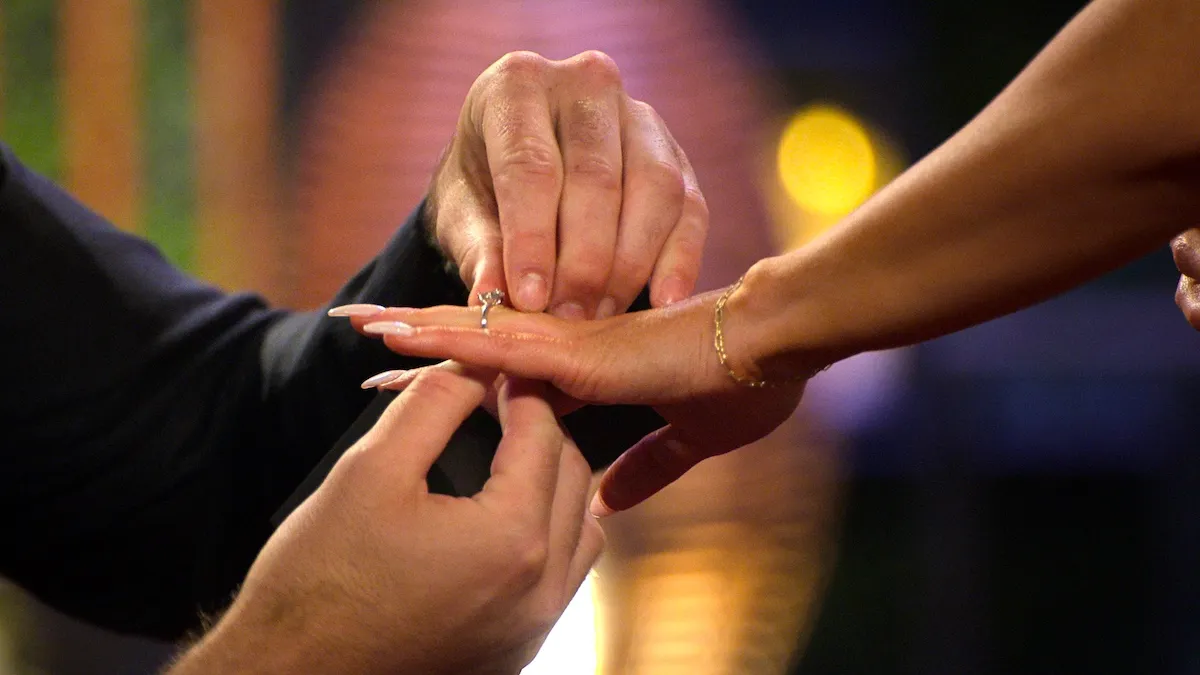 A man putting a ring on a woman's finger in 'Love Is Blind' Season 10