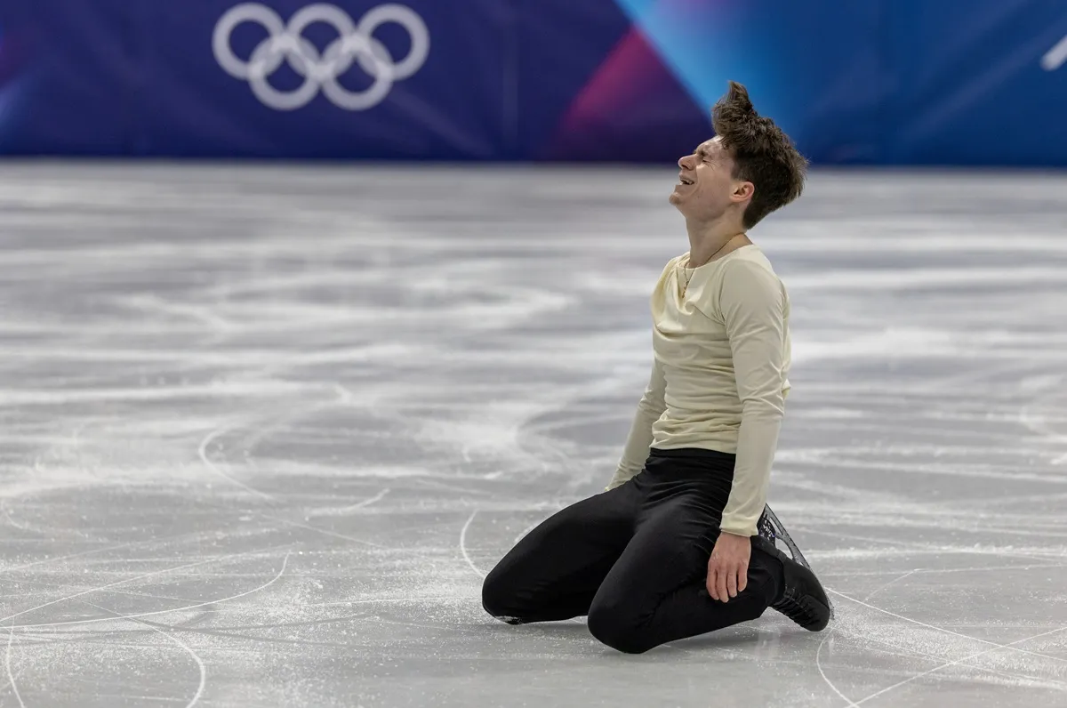 Maxim Naumov of the United States reacts after performing his routine during Men's Single Skating