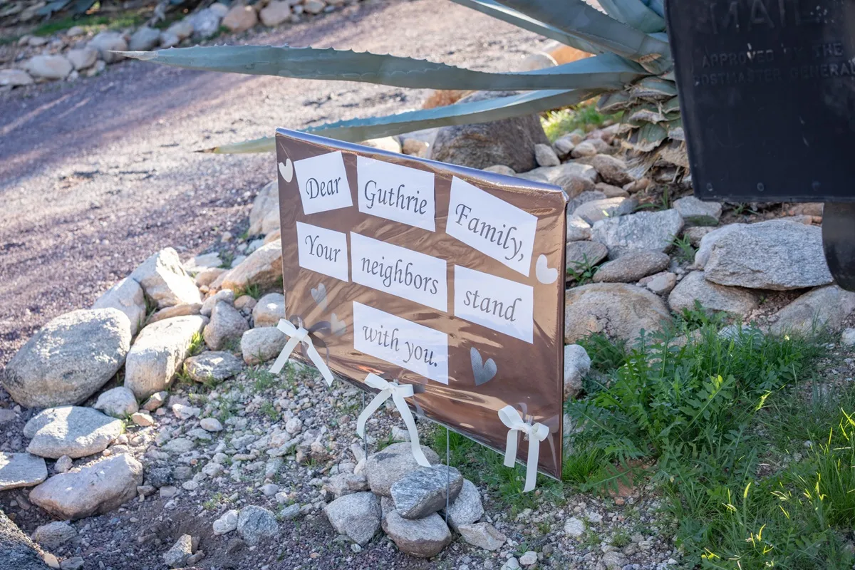 A sign is posted at the house of Nancy Guthrie, NBC host Savannah Guthrie's mother, on February 3, 2026 in Catalina, Arizona.