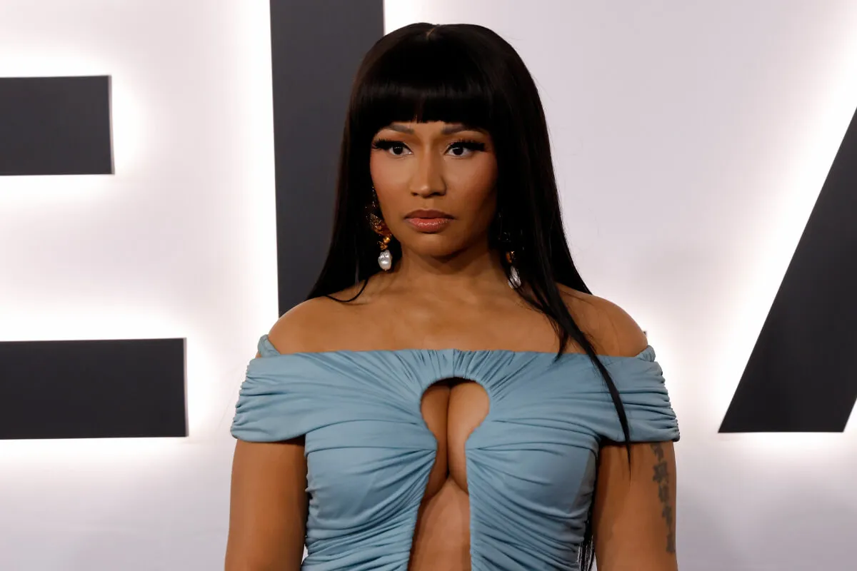 Nicki Minaj wears a blue dress with a key hole cutout.