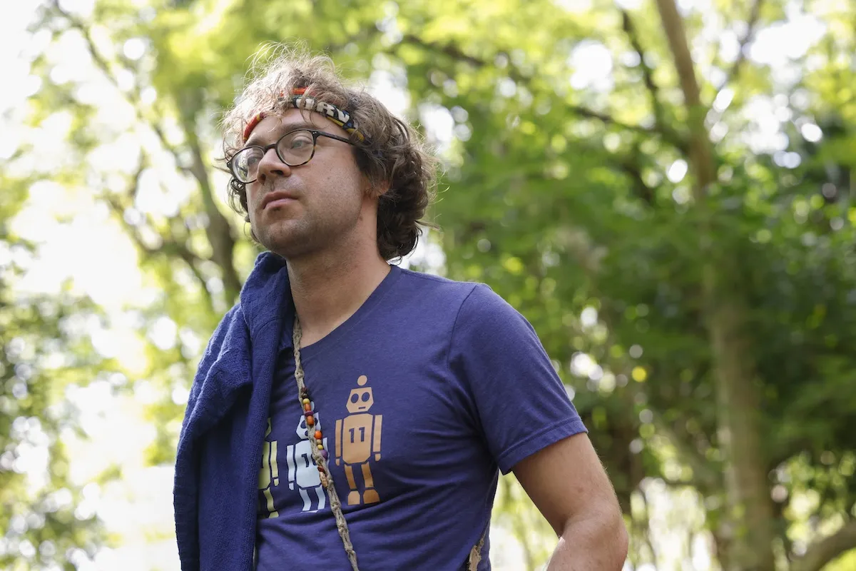 Christian Hubicki wearing glasses and a headband on Survivor 50