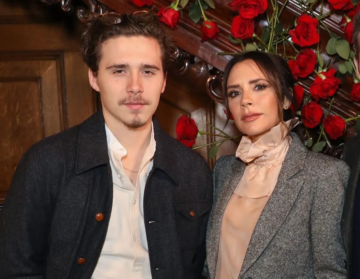 Brooklyn Beckham and Victoria Beckham attend the Kent & Curwen presentation during London Fashion Week