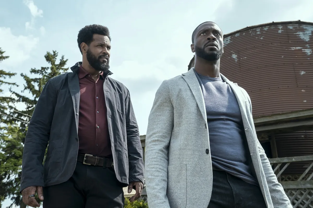 Low-angle shot of John Sampson (Isaiah Mustafa), Alex Cross (Aldis Hodge) in 'Cross' Season 2 finale