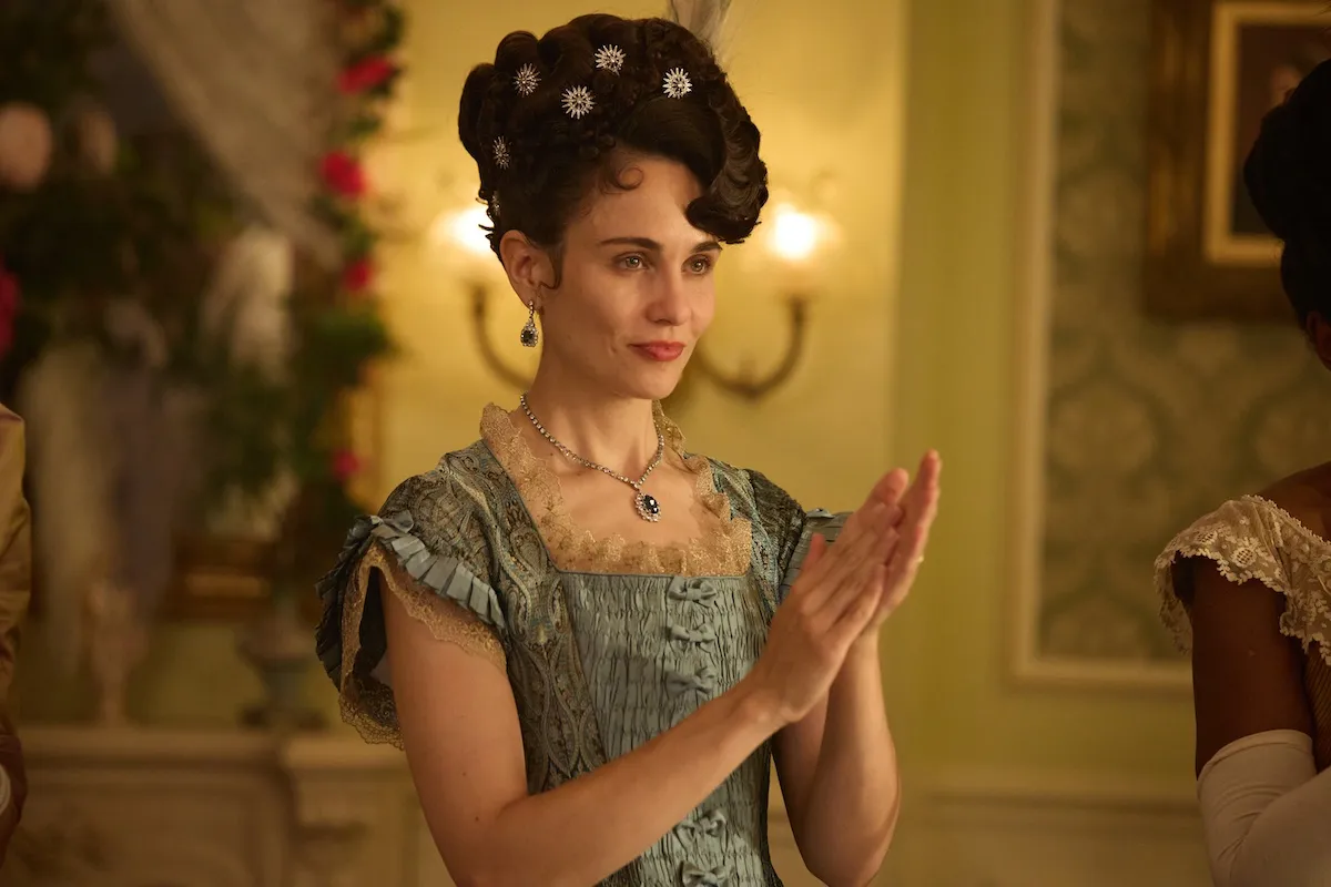 Tuppence Middleton as Frances Forsyte in 'The Forsytes,' clapping