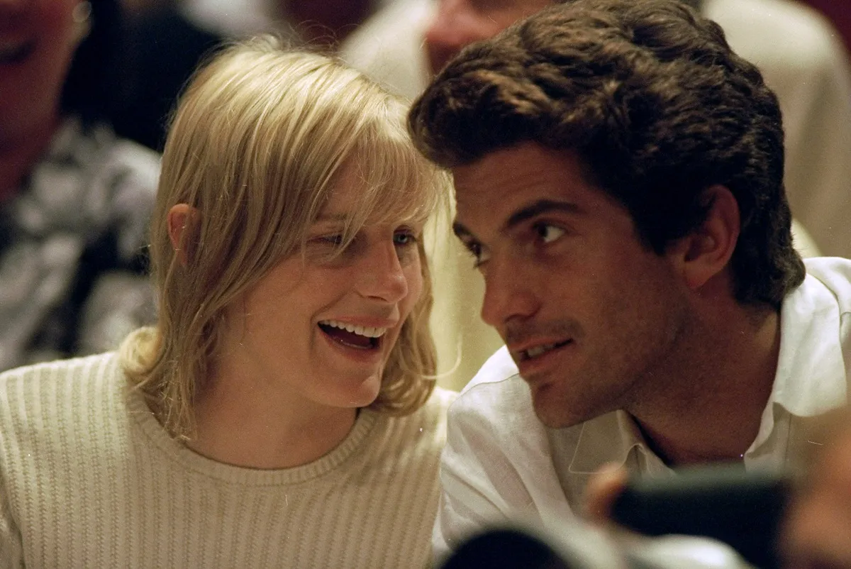 John F. Kennedy Jr. and Darryl Hannah watch game between the New York Knicks and the Houston Rockets at Madison Square Garden.