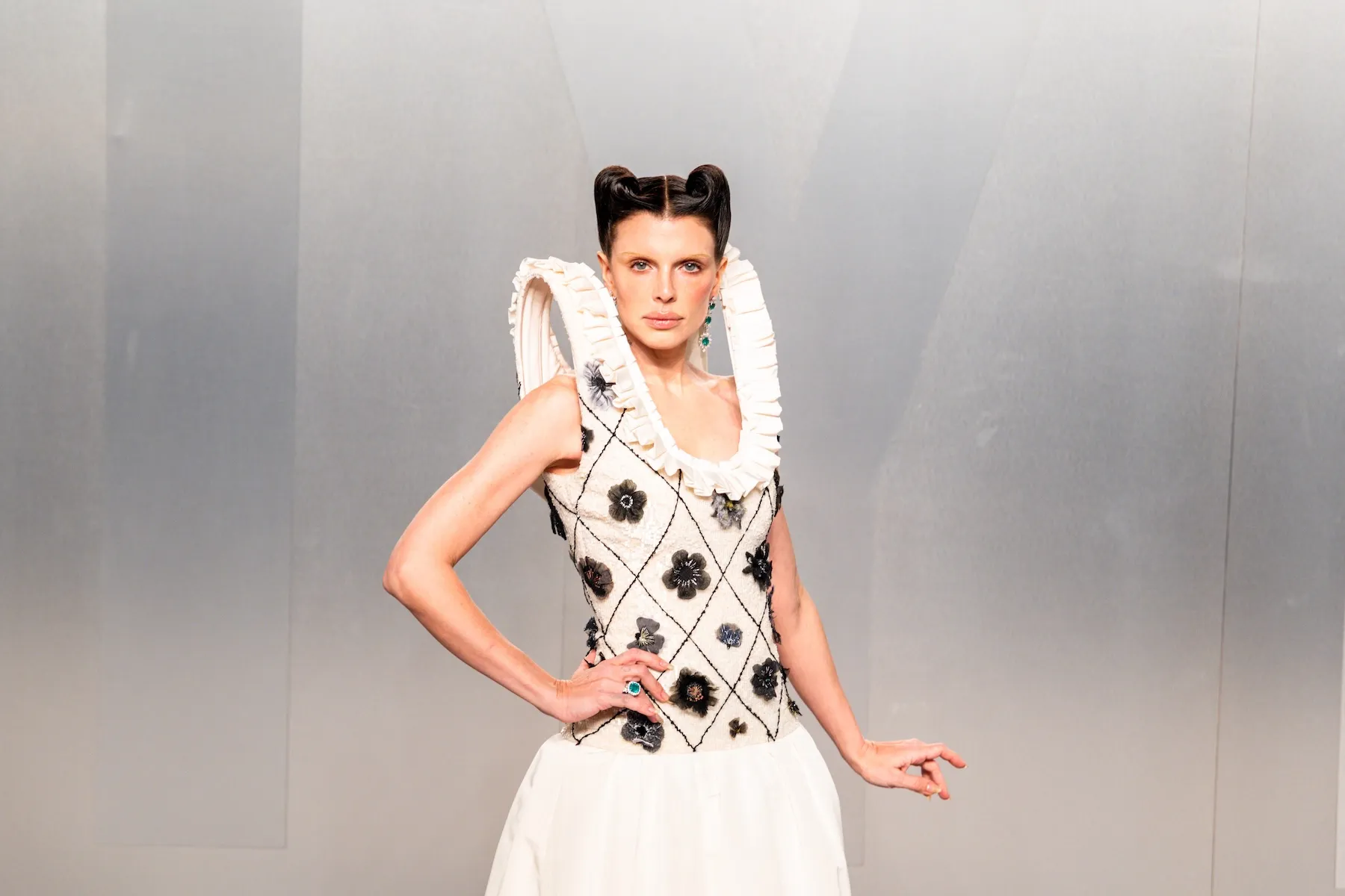 Julia Fox in a black and white dress at the Vanity Fair Oscar party