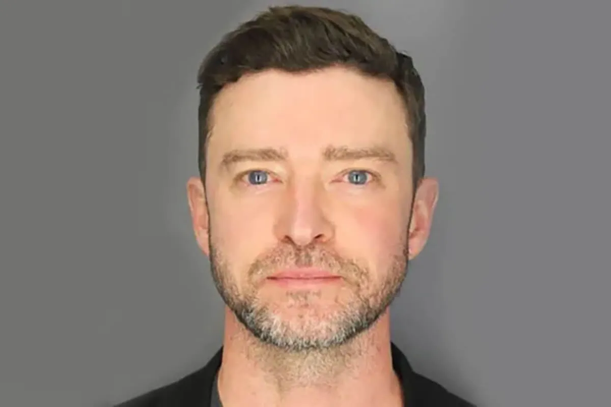 Justin Timberlake wears a black shirt in his mugshot after his arrest.