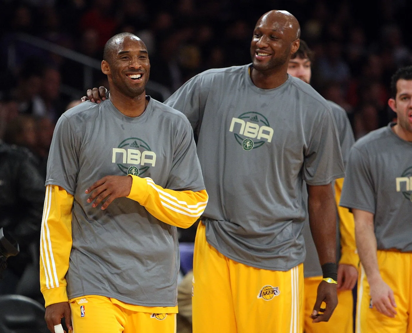 Kobe Bryant and Lamar Odom smiling on the basketball court