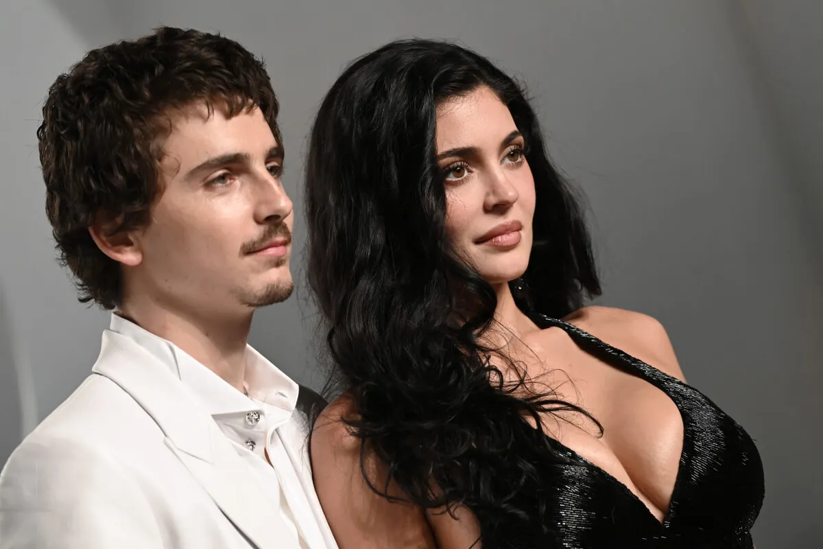 Timothee Chalamet wears a white suit and Kylie Jenner wears a black dress at the Oscars.