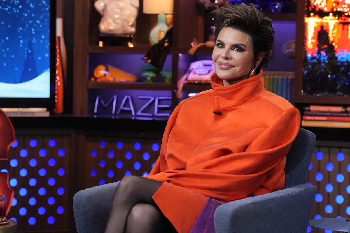 'The Real Housewives of Beverly Hills' alum Lisa Rinna in an orange top on 'Watch What Happens Live'