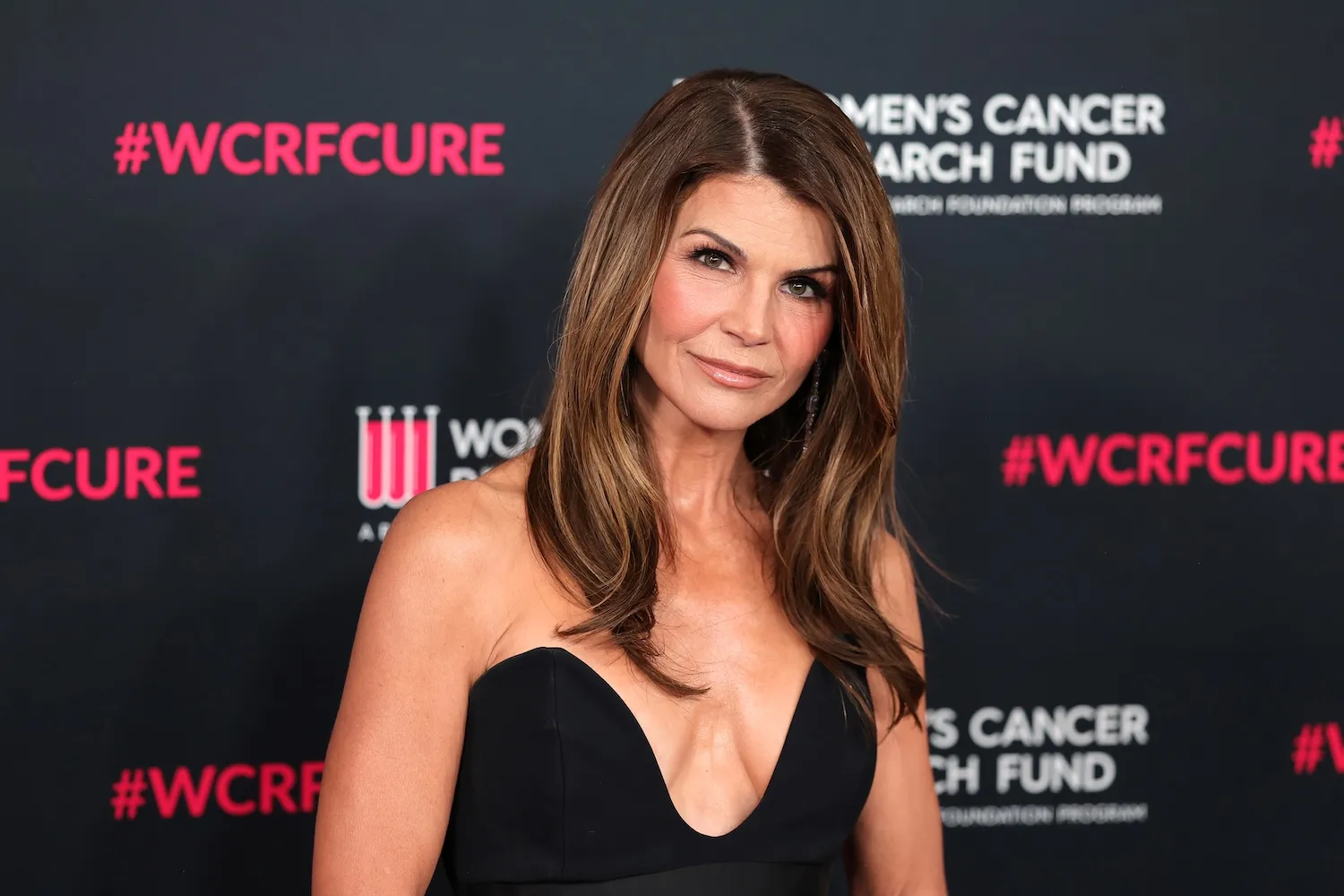 Lori Loughlin in a strapless black dress for an event in 2026