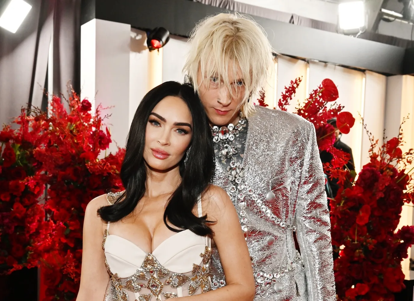 Megan Fox and Machine Gun Kelly posing at the 65th Grammy Awards
