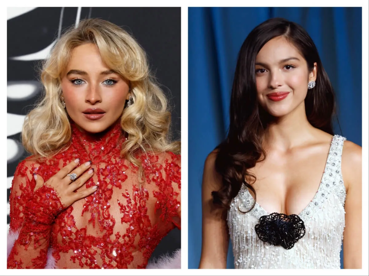 Sabrina Carpenter wears a red dress and stands with her hand on her chest. Olivia Rodrigo wears a white dress with a black rosette.