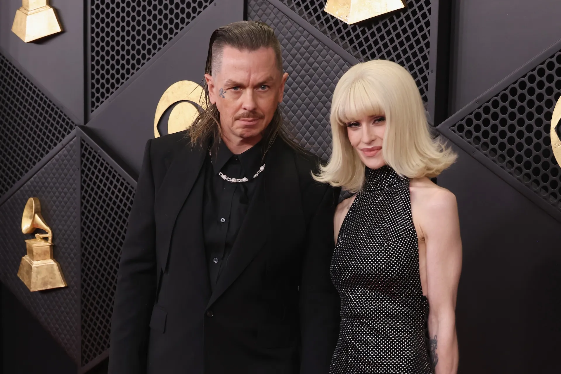 Sid Wilson and Kelly Osbourne posing at the Grammy Awards in 2026