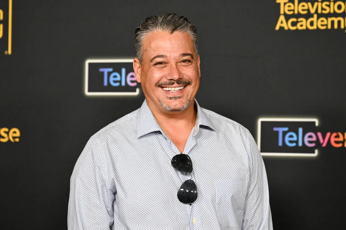 'Survivor' star Boston Rob wears a collared shirt with his sunglasses hanging from the collar.