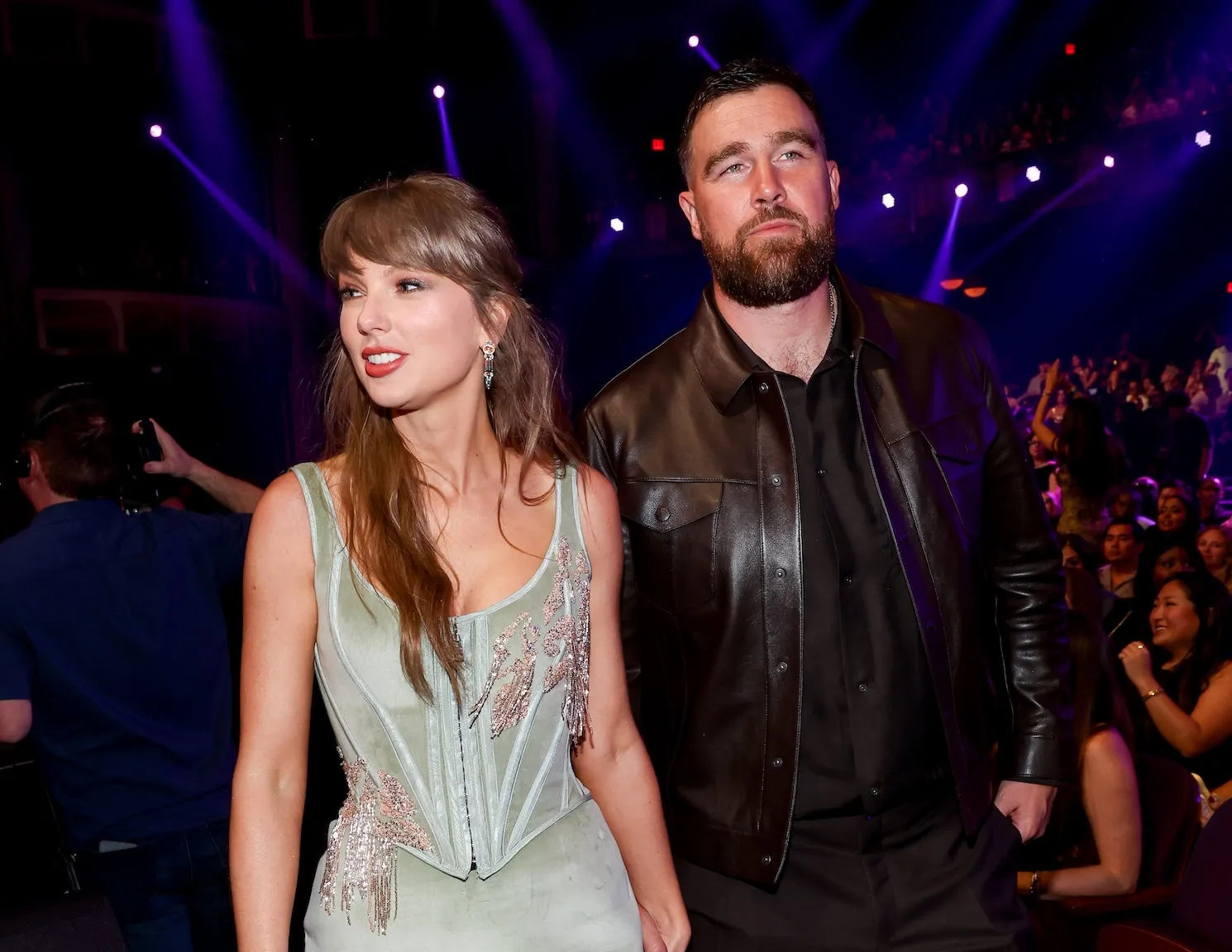 Taylor Swift and Travis Kelce holding hands at the 2026 iHeartRadio Music Awards