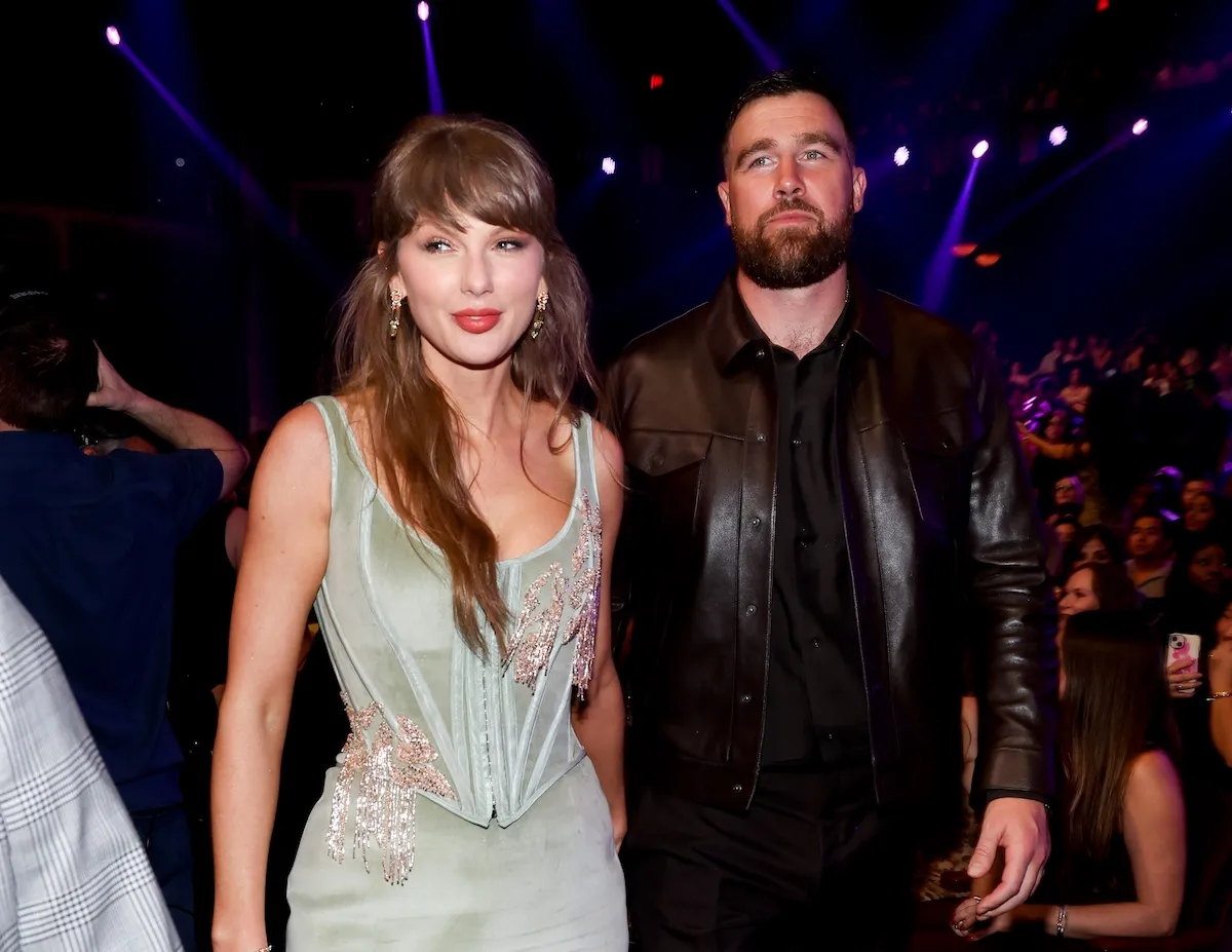 Taylor Swift, in a seafoam green corset dress, and Travis Kelce at the iHeart Radio Music Awards