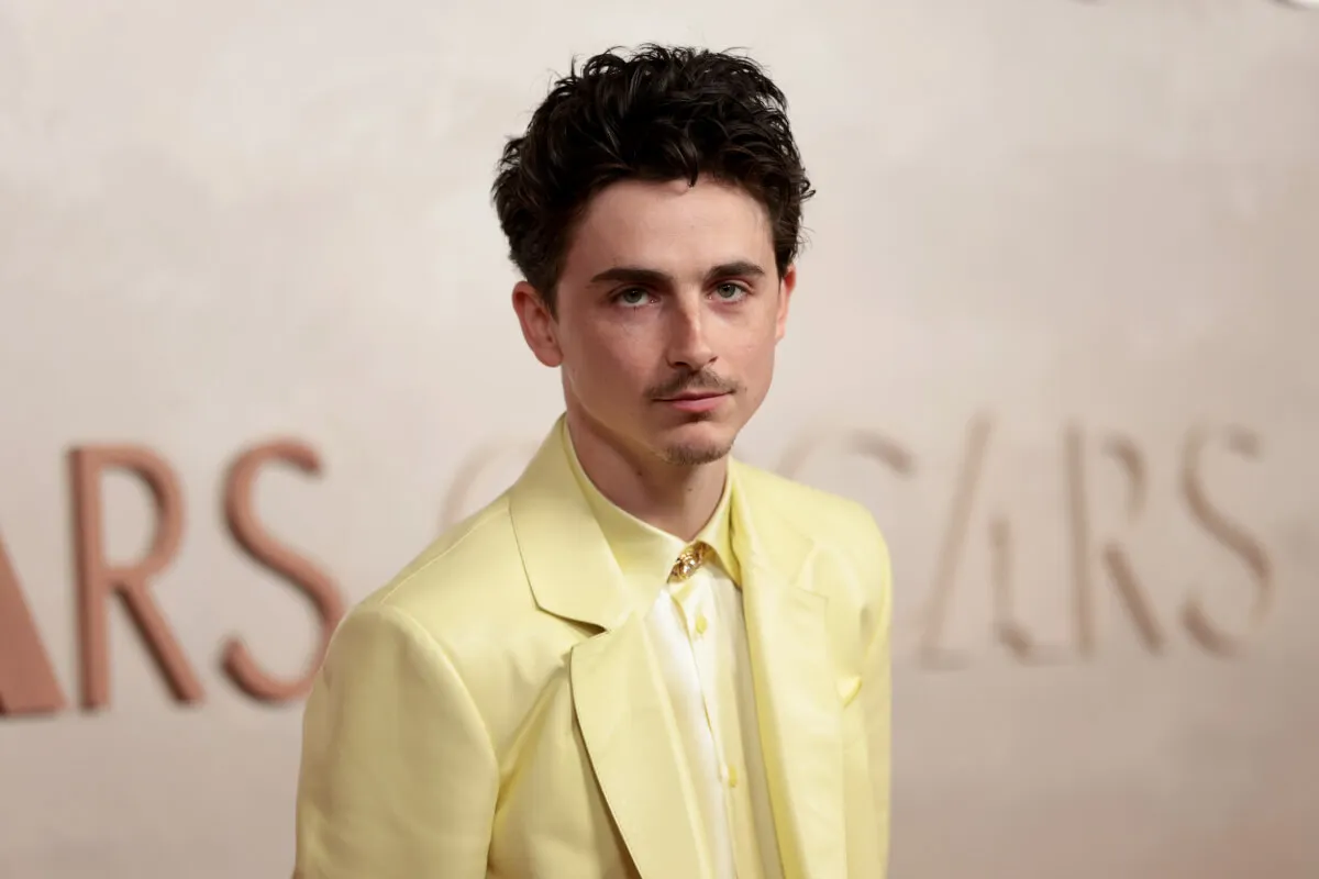 Timothee Chalamet wears a yellow suit.