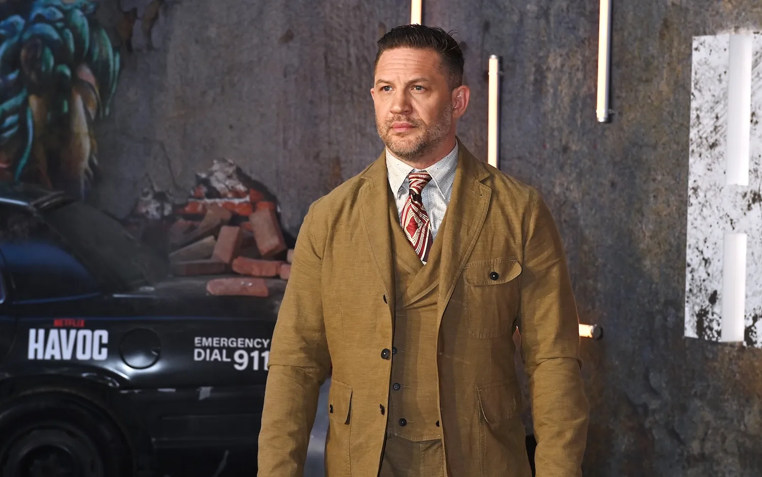 'Peaky Blinders' star Tom Hardy in a brown suit for a world premiere in 2025