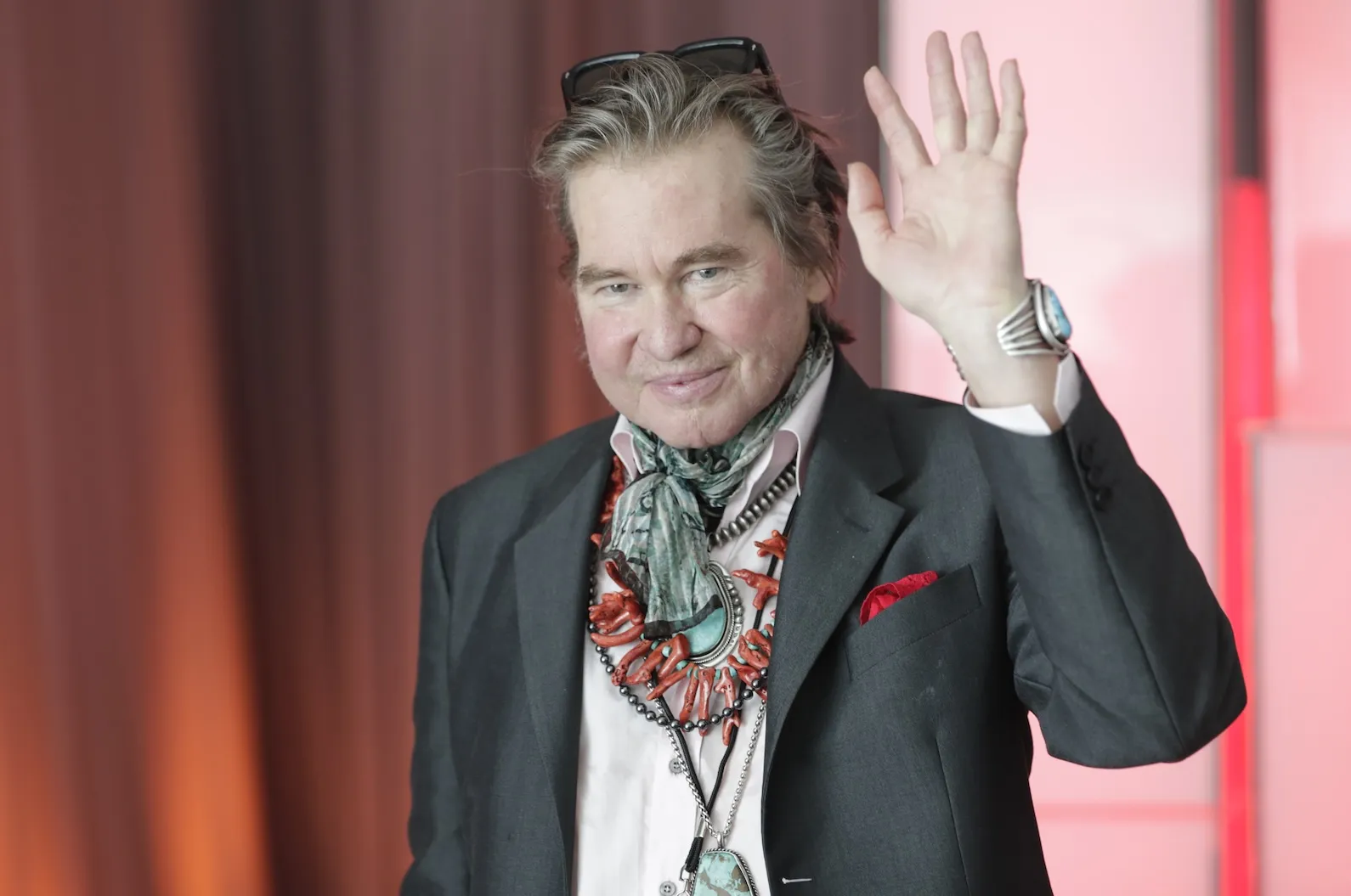 Actor Val Kilmer waving in 2019