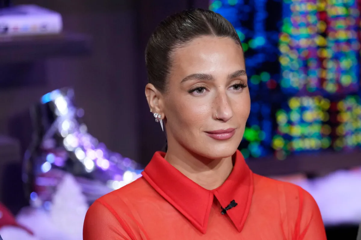 Amanda Batula wears a red collared shirt.