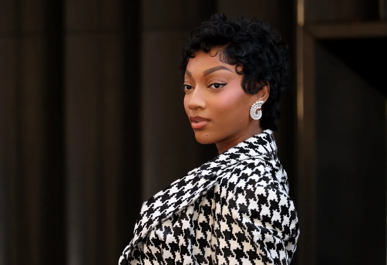 Angel Reese in a houndstooth jacket at the Victoria's Secret flagship store