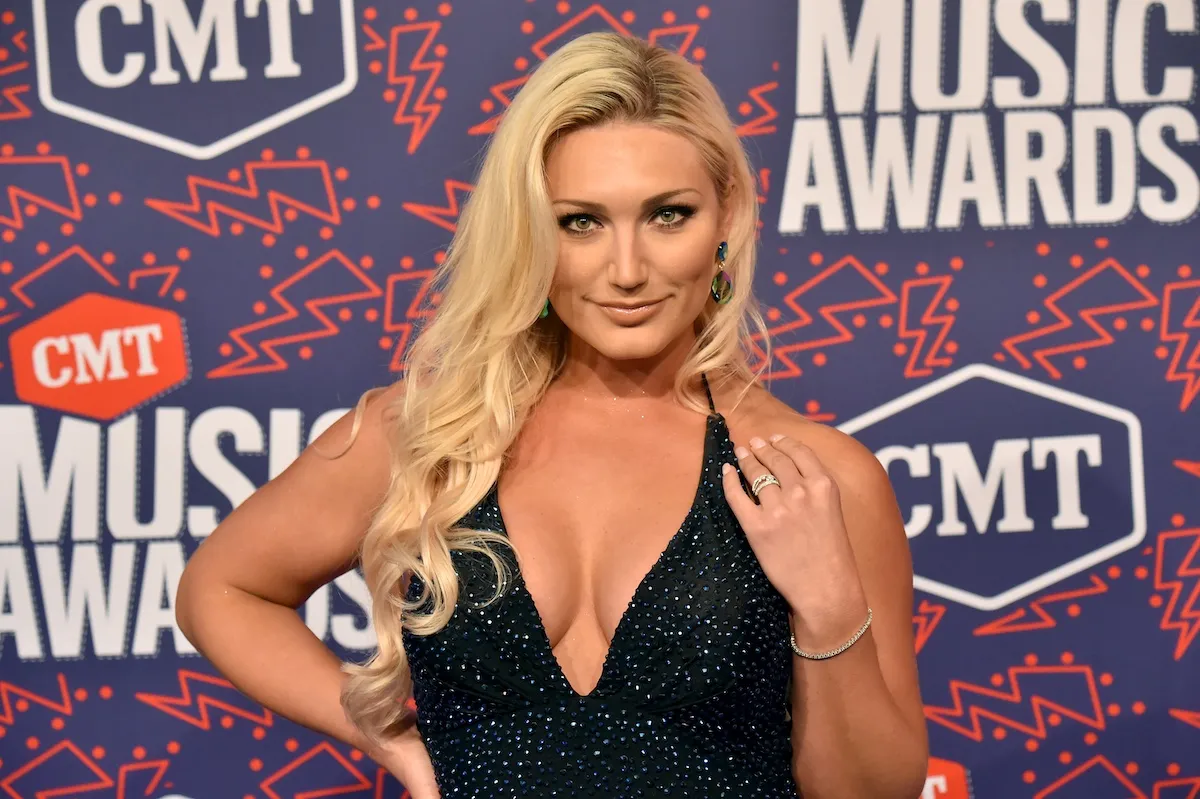 Brooke Hogan in a sparkly black sleeveless dress